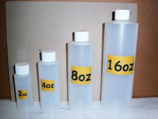 LOT OF 60 2oz PLASTIC BOTTLES W/WHITE RIBBED CAPS