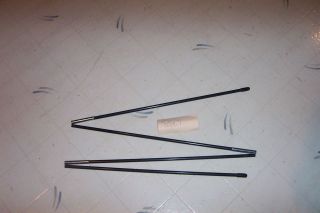 Tent Pole with Cord measuring approx. 74 inches in 4 sections. 5/16 in 