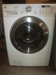 Front Load White LG Tromm Washer and Dryer. Pedestals not included 