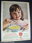 50s image cute little girl eating Campbells Chicken Noodle Soup 1958 