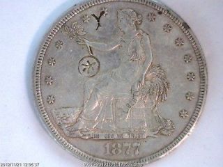 1877 S SILVER TRADE DOLLAR WITH ORIENTAL CHOP MARKS OUTSTANDING TO SAY 