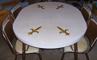   Fleur de lis dining room table chair set 1960s formica oval round leaf