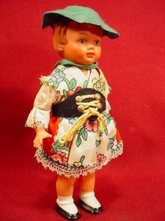 VINTAGE CELLULOID WIND UP DANCING DOLL WITH KEY
