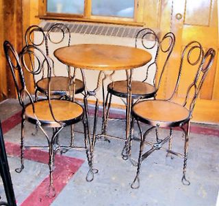 Antique icecream oak top table with 4 iron frame chairs