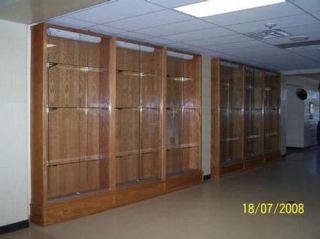 High School Trophy cases with the lights off.