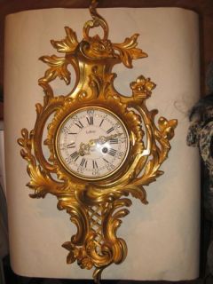 gilded bronze wall clock by leroy paris 