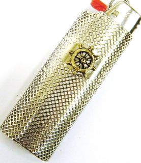 Small brass ships wheel on a bic lighter case plated antique silver 