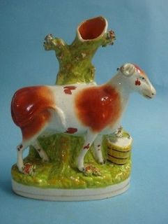 unusual staffordshire spill vase figure of a cow from united