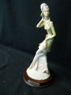 porcelain figurine signed by the artist a belcari time left