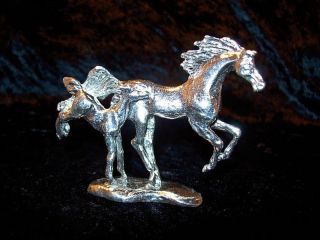 pewter and silver horse figurine  14 00