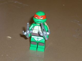 Lego TMNT Teenage Mutant Ninja Turtles Red Raphael w weapons NEW