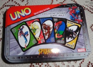 spiderman uno card game in collectible tin all cards are there these 
