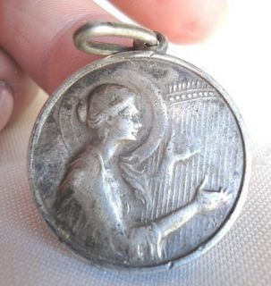 EXQUISITE VINTAGE SAINT CECILIA PLAYING HER HARP SILVER MEDAL.