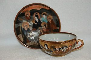 Japanese Satsuma Dragons and Elders Teacup and Saucer marked
