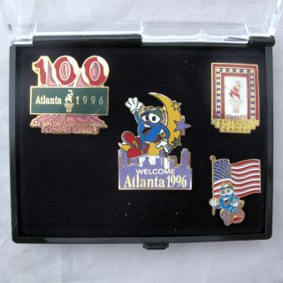   OLYMPIC GAMES OFFICIAL CLASSIC COLLECTOR PIN SET FOUR PINS IN CASE