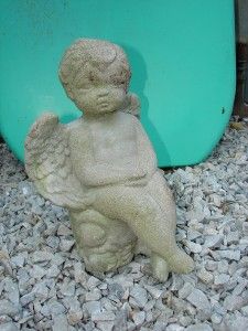 vintage concrete angel sitting on flower stump mold