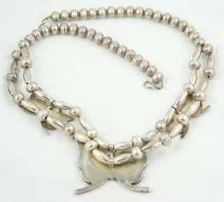 Handcrafted by Navajo Joe Corbet. The necklace and bracelet both bear