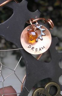 copper disc dream gear and an orange crystal ab bead