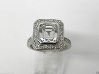 05ct EMERALD CUT DIAMOND CENTER GIA VVS2 I Color. Custom Plat Ring