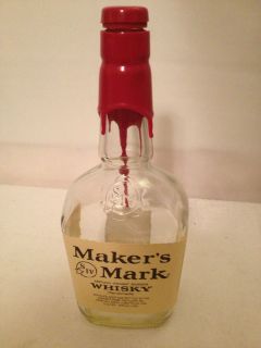 Empty decorative glass bottle makers mark Kentucky bourbon whisky