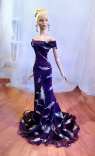this gown is made from a dark purple eggplant color mesh