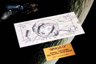 This board features a sketch of a scene featuring Jim Lovell in the