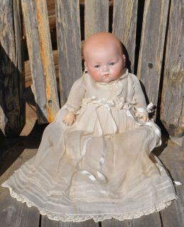 antique porcelain doll by armand marseille infant baby time left
