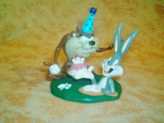 of Tasmanian Devil Tazz  with Bugs Bunnys Birthday Cake