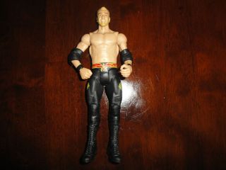 Christian Mattel Basic in black tights with red and yellow designs wwe