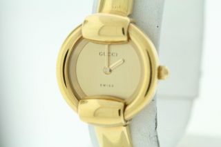 Ladies Gucci 1400L Gold Tone Gold Dial Bangle Bracelet Watch