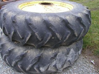 18 4 x 38 GY 6ply tires on John Deere tractor 9 bolt press steel rims