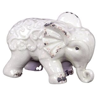 White Ceramic Elephant (WhiteDimensions: 7 inches high x 10.5 inches wide x 6 inches deep CeramicColor: WhiteDimensions: 7 inches high x 10.5 inches wide x 6 inches deep)